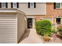 Inviting entryway with walkway, front door, and lush landscaping at 5901 Quail Hollow Rd # G, Charlotte, NC 28210