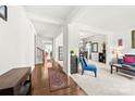 Bright foyer showcasing hardwood floors, an open floor plan, and contemporary decor at 6702 Carradale Way, Charlotte, NC 28278
