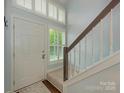 Bright entryway with staircase, natural light and views to the outside at 8251 Tradd Ct, Charlotte, NC 28210