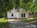 Exterior showcases a well-maintained lawn, classic siding, and an inviting driveway at 8332 Highlander Ct, Charlotte, NC 28269