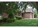 Brick home with well-maintained lawn and mature landscaping at 904 3Rd Street Ne Pl, Conover, NC 28613