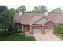 Charming brick home with a two-car garage and a well-manicured lawn at 904 3Rd Street Ne Pl, Conover, NC 28613