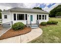 Inviting front entrance with a walkway and beautiful landscaping that enhances the home's curb appeal at 109 Georgia Belle Ave # 199, Belmont, NC 28012