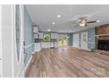 Open-concept living room features a stone fireplace and ample natural light at 1195 Ralph B Keener Rd, Lincolnton, NC 28092