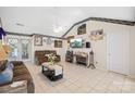 Comfortable living room with a ceiling fan and access to the dining area at 12305 Portrush Ln, Charlotte, NC 28273