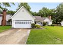 Charming single-Gathering home with a manicured lawn, two-car garage, and inviting curb appeal at 13324 Kintyre Ct, Matthews, NC 28105