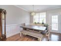 Bright dining area featuring wood floors, wainscotting, and natural light at 139 High Ridge Rd, Mooresville, NC 28117