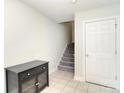Bright entryway with tile floors, stairs, a closet, and access to the garage at 139 High Ridge Rd, Mooresville, NC 28117