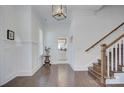 Inviting foyer with hardwood floors, wainscoting, and staircase to the upper level at 1528 Half Pint Loop, Fort Mill, SC 29708