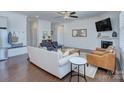 Spacious living room with fireplace, ceiling fan, and hardwood floors at 1528 Half Pint Loop, Fort Mill, SC 29708