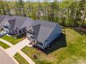 Stunning aerial view of the home with manicured lawns, landscaping, and neighborhood setting at 19006 Brandon James Dr, Cornelius, NC 28031