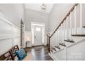 Elegant foyer with high ceilings, hardwood floors, staircase, and a welcoming ambiance at 19006 Brandon James Dr, Cornelius, NC 28031