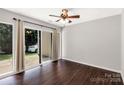 Bedroom featuring hardwood floors, fan and sliding door with backyard access at 194 Riverview Ter, Clover, SC 29710