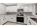 Bright kitchen with white cabinets, stainless steel appliances, and granite counters at 194 Riverview Ter, Clover, SC 29710