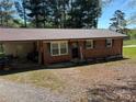 A single-story brick home featuring a covered carport and a well-maintained front yard at 22 Heritage View Rd, Hickory, NC 28601
