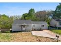 Well-maintained house featuring neutral siding, a modern roof, and a manicured yard at 300 Cherry St, Belmont, NC 28012