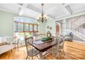 Bright dining room with a large wooden table, chairs, and window at 401 Yorkfield Dr, Shelby, NC 28150