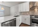 Bright kitchen with white cabinets, stainless steel appliances, and an island with a sink at 4109 Bryant Terraces Dr, Charlotte, NC 28208