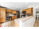 Well-lit kitchen with wooden cabinets, stainless steel appliances, and stylish countertops at 4605 Hedgemore Dr # I, Charlotte, NC 28209
