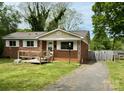 Quaint brick home featuring a lovely yard, walkway, and driveway at 4623 Monmouth Dr, Charlotte, NC 28269
