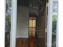 Welcoming entryway showcasing hardwood floors, a chandelier, and an open view into other living spaces at 4704 Beech Crest Pl, Charlotte, NC 28269