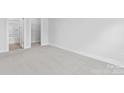 Carpeted bedroom with neutral colors and ample natural light, creating a serene and comfortable atmosphere at 714 Falling Oak Aly # 18, Huntersville, NC 28078