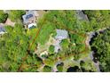 Aerial view of property featuring mature trees, lush landscaping, pool, and defined property lines at 729 Lochaven Rd, Waxhaw, NC 28173