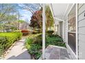 Landscaped side yard with lush greenery, stone accents, and a well-maintained walkway at 817 Sardis Cove Dr, Charlotte, NC 28270