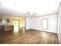 Open living space featuring hard surface floors, bright lighting, and kitchen access at 828 Long Bow Rd, Salisbury, NC 28144