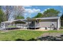 Backyard view featuring a carport, providing covered parking and outdoor storage solutions at 8705 Carroll St, Hickory, NC 28601