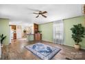 Open-concept living area with wood-look floors and a neutral color palette at 8705 Carroll St, Hickory, NC 28601