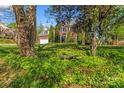 Charming two-story brick house nestled amongst mature trees and foliage in a peaceful setting at 111 Woodfern Pl, Mooresville, NC 28115