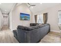 Comfortable living room with vaulted ceilings, hardwood floors and decorative curtains at 113 Mcgill Nw Ave, Concord, NC 28025