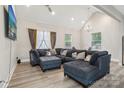 Bright living room with luxury vinyl flooring, lots of light, and vaulted ceilings at 113 Mcgill Nw Ave, Concord, NC 28025