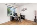 Bright home office with hardwood floors, a large window, and modern decor at 1176 Shiloh Bend Trl, Fort Mill, SC 29715