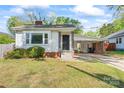 Cozy one-story home with black door security and a convenient carport at 288 Fink Nw Ave, Concord, NC 28025