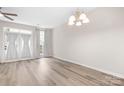 Open-concept dining room features modern flooring, natural light, and neutral color palette at 3906 Thomas Ridge Dr, Charlotte, NC 28269