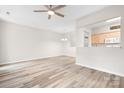 Open layout featuring light colored floors, a view of kitchen appliances, and a spacious living area at 3906 Thomas Ridge Dr, Charlotte, NC 28269
