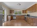Traditional kitchen with stainless steel appliances, wood cabinets, and ample counter space at 510 S Carolina Ave, Spencer, NC 28159