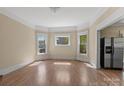 Bright living room with beautiful hardwood floors and natural light from large windows at 510 S Carolina Ave, Spencer, NC 28159