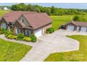 Detached garage with multiple bays and a covered carport, situated on a large lot at 514 Clover Leaf Rd, Marshville, NC 28103