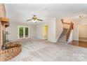 Spacious living room with a brick fireplace and staircase to the second floor at 6769 Highway 557 None, Clover, SC 29710