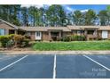 Well-kept home featuring a manicured lawn, ample parking, and visible 'For Sale' signage at 704 Colby Cir, Salisbury, NC 28147