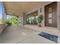 Spacious covered patio with wood ceiling, fireplace, and sliding glass doors to the interior at 721 Charles Ave, Charlotte, NC 28205