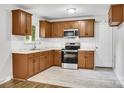 Eat-in kitchen featuring stainless steel appliances, a window view and decorative tile backsplash at 801 Bilmark Ave, Charlotte, NC 28213