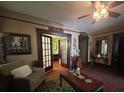 Inviting living room featuring a ceiling fan, rich woodwork, and plenty of natural light at 829 Green St, Salisbury, NC 28144