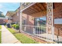 Charming brick apartment exterior featuring a cozy porch and manicured landscaping, inviting residents to relax and enjoy the outdoors at 103 Carriage House Dr, Kannapolis, NC 28081