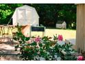 Relaxing backyard patio featuring outdoor furniture and picturesque views of a cottage-style shed at 106 Friendfield Dr # B, Fort Mill, SC 29715