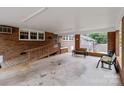 Spacious covered patio with brick pillars and a wooden ramp entrance at 182 Ryan St, Salisbury, NC 28144