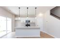 Modern kitchen featuring an island, stainless appliances and white cabinets at 2021 Endeavor Run, Charlotte, NC 28269